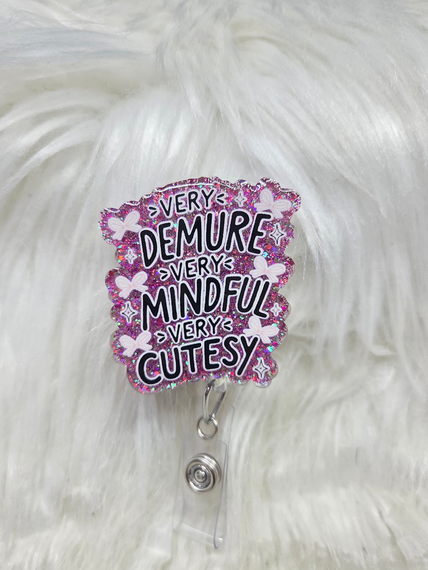 Demure Badge Reel