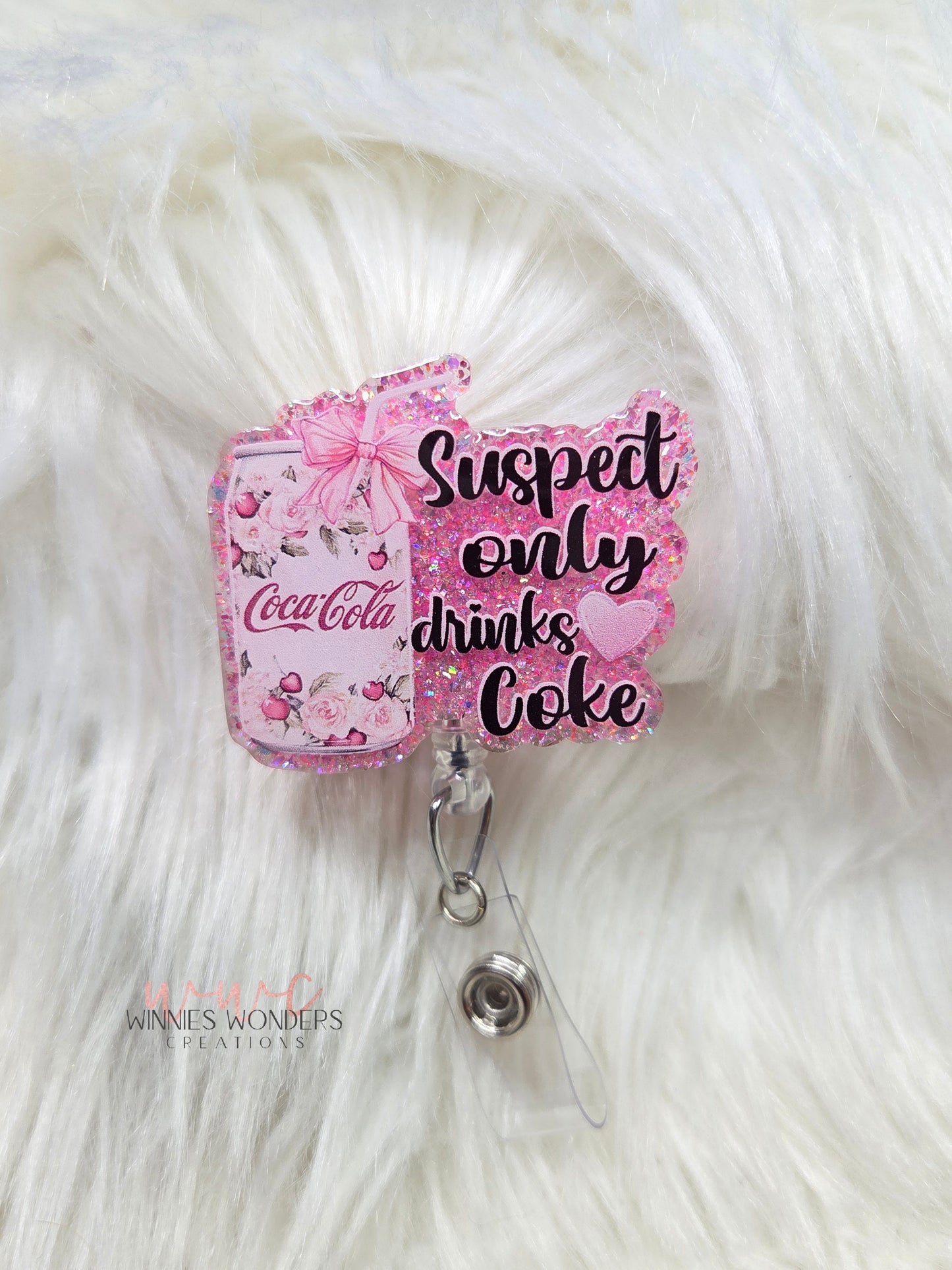Suspect only drinks Coke Badge Reel
