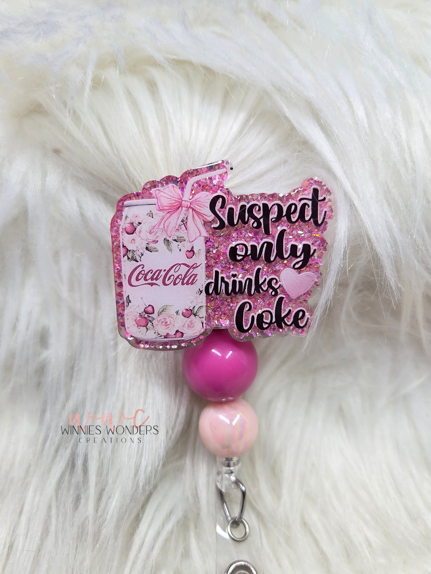 Suspect only drinks Coke Badge Reel