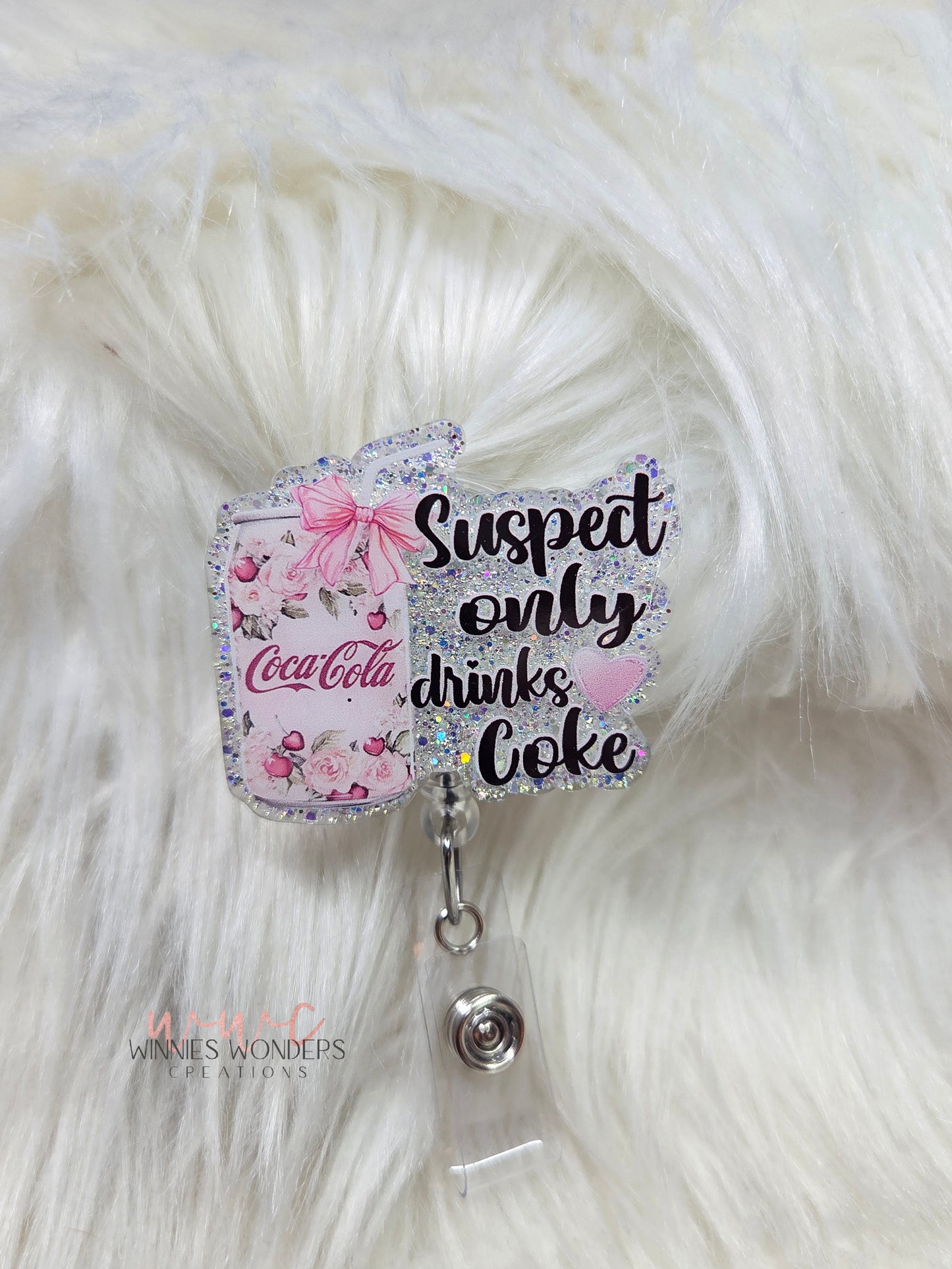 Suspect only drinks Coke Badge Reel