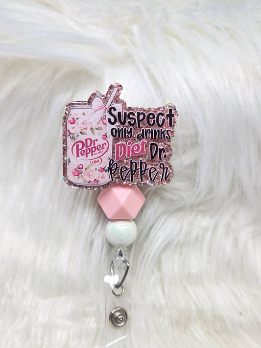 Suspect only drinks diet DP Badge Reel
