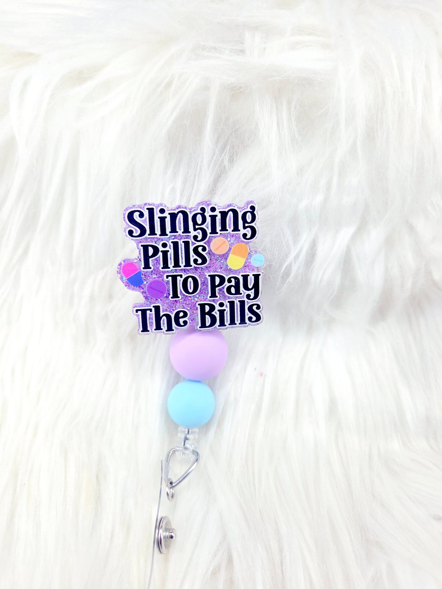 Slinging Pills Badge Reel