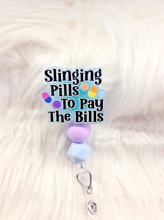 Slinging Pills Badge Reel